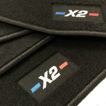 Custom-made BMW X2 F39 (2018-2023) floor mats with embroidered logo